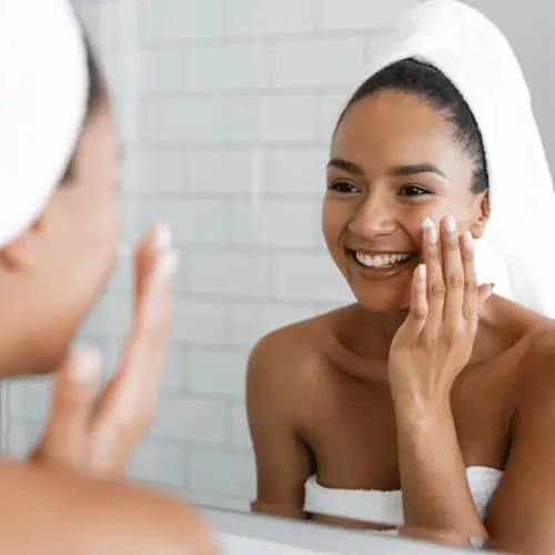 woman applying skincare products
